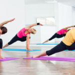 44845321 - four girls practicing yoga, vasisthasana half side plank pose